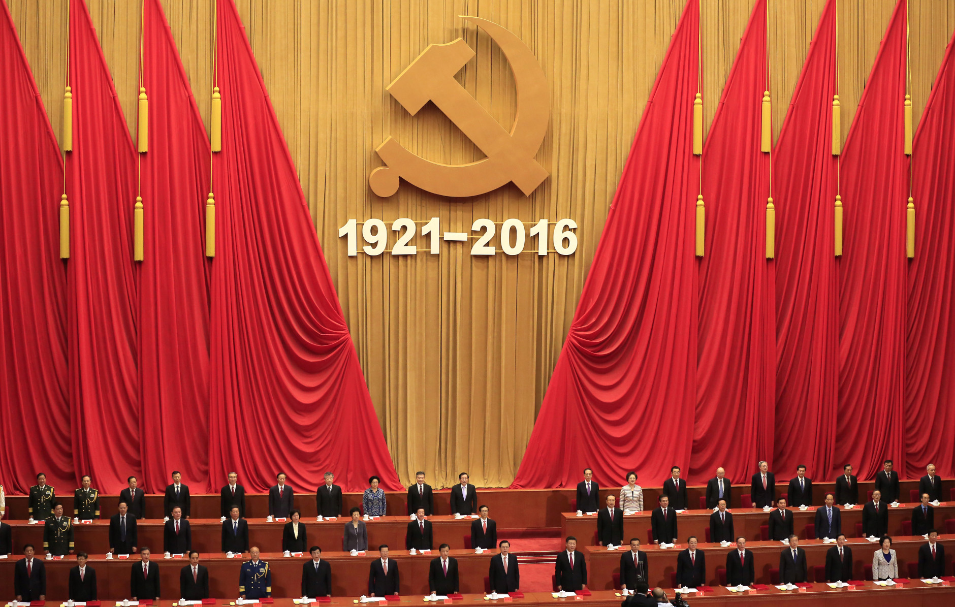 Chinese President Xi Jinping, 10th from left in first row, delivers his speech during a celebration ceremony to mark the 95th anniversary of the founding of the Communist Party of China at the Great Hall of the People in Beijing, Friday, July 1, 2016. (How Hwee Young/Pool Photo via AP)